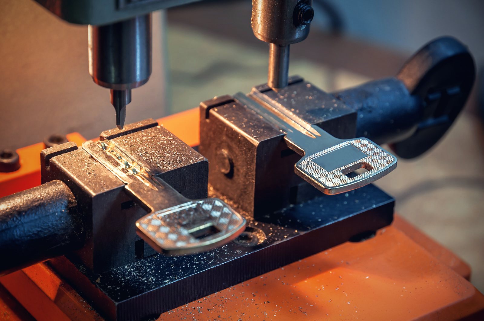 Brass key being cut on a key cutting machine